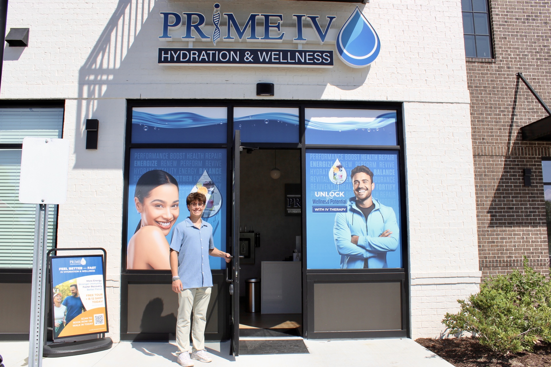Welcoming entrance of Prime IV Hydration & Wellness Nolensville with a team member holding the door open